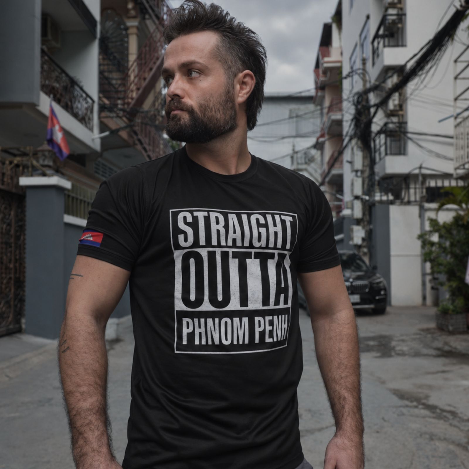 Man wearing a Straight Outta Phnom Penh T-shirt
